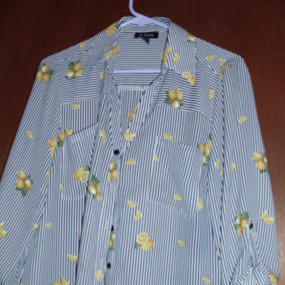 size xl. striped black whote blouse with yellow lemons on it.